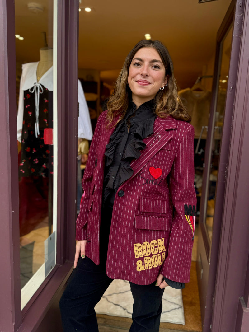 woman wearing red pinstripe blazer