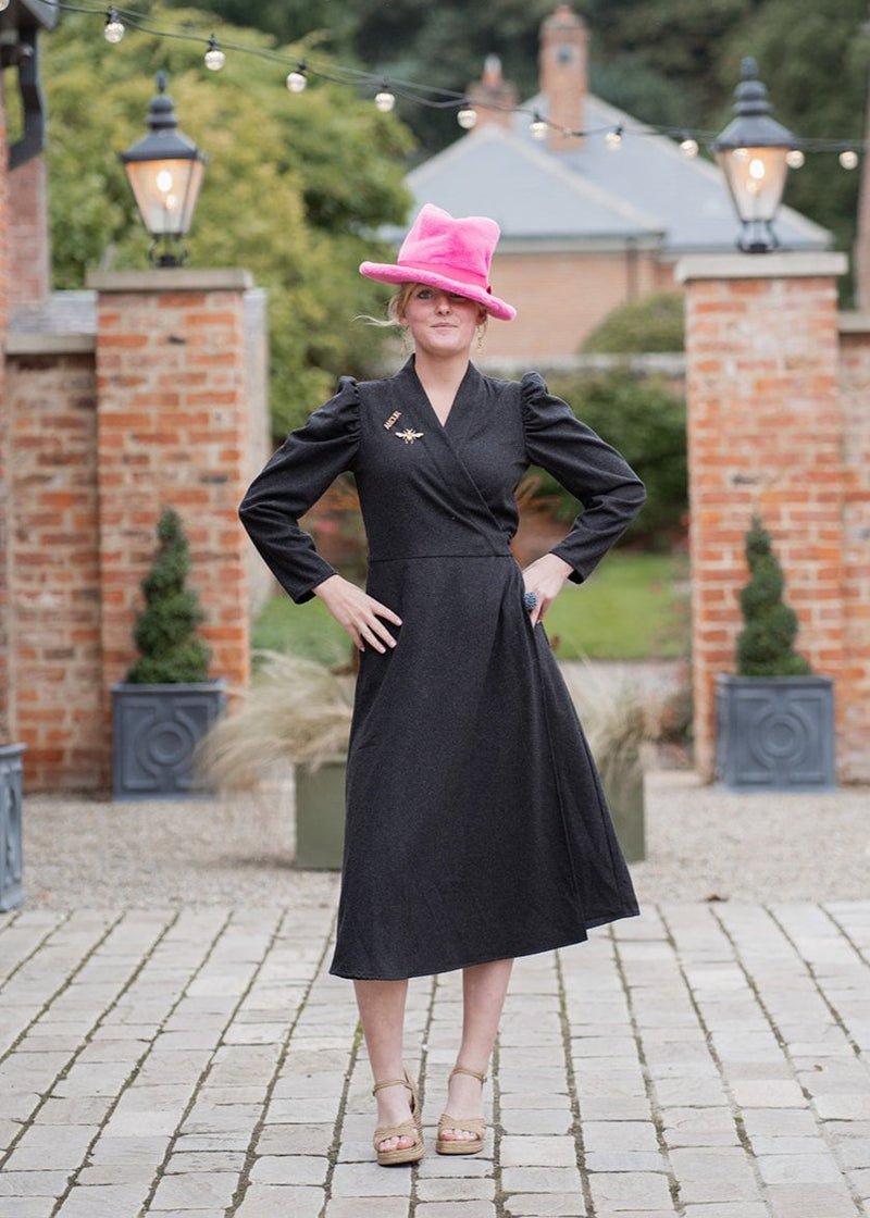 woman wearing Line of Oslo Scarlett dress with pink hat