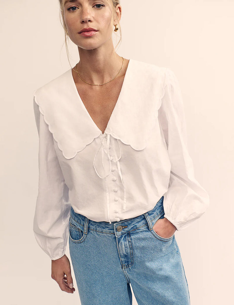 woman wearing Nobody's Child Birdie blouse (white)