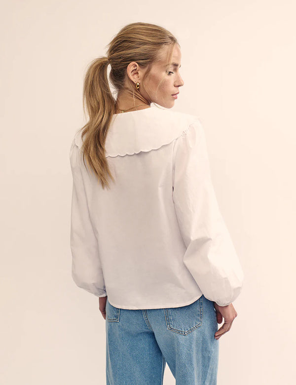 woman wearing Nobody's Child Birdie blouse (white) back oversized collar