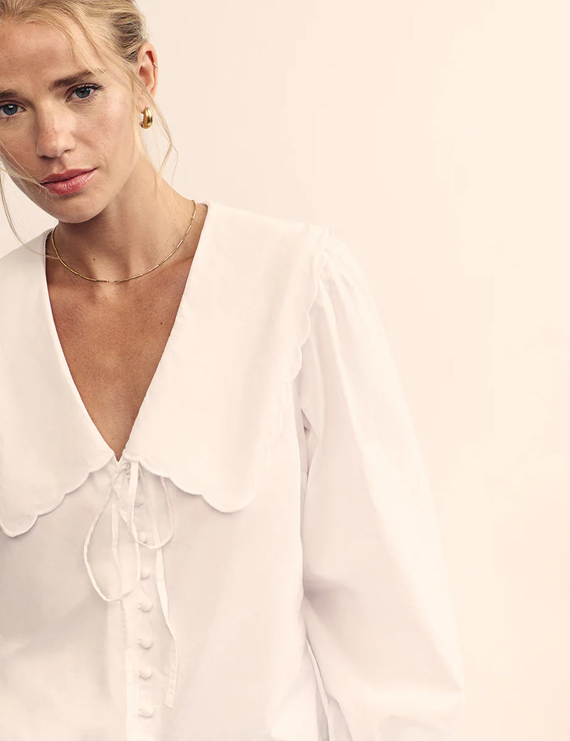 woman wearing Nobody's Child Birdie blouse (white) detail