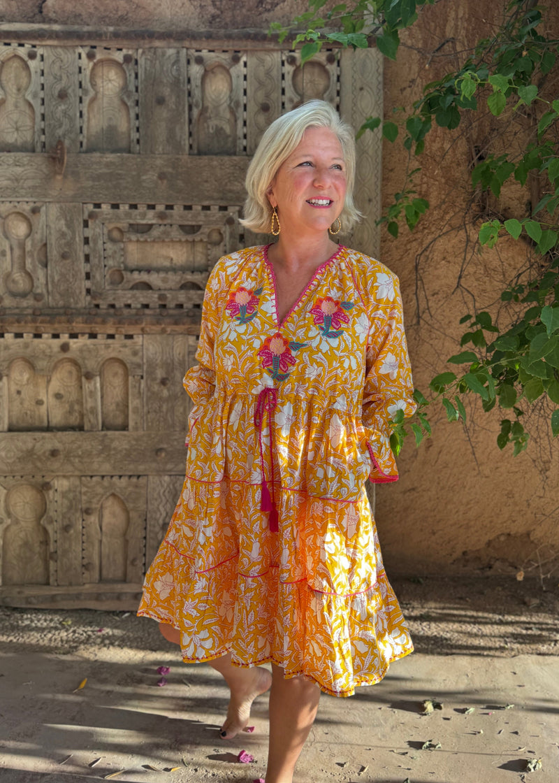 woman wearing Place du Soleil floral embroidered dress in Morrocco