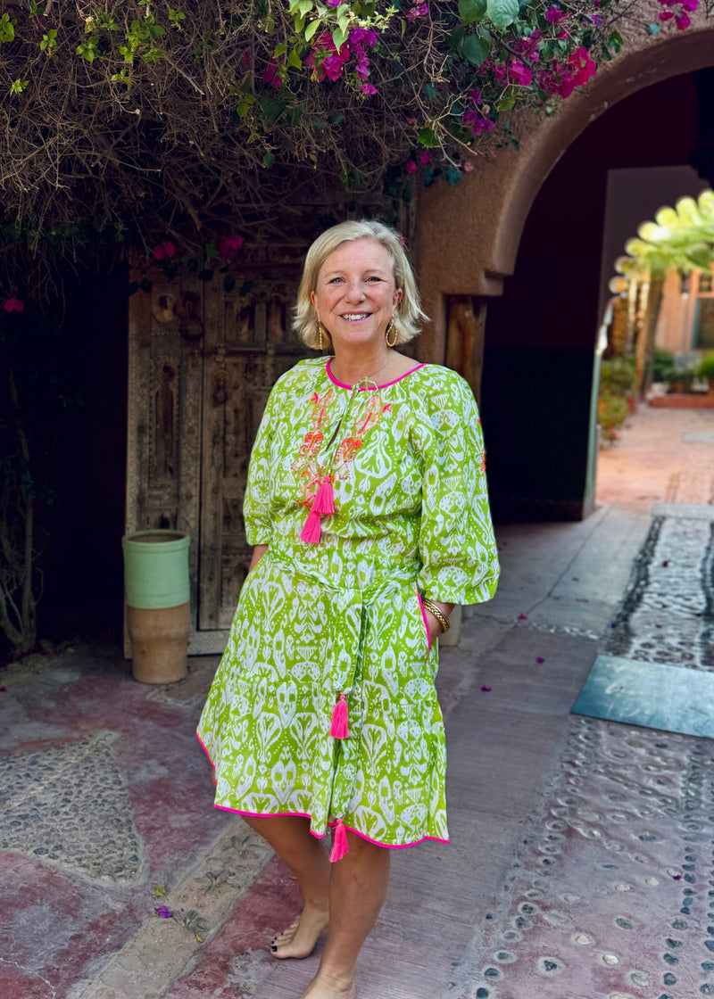 woman wearing Place du Soleil lime green dress