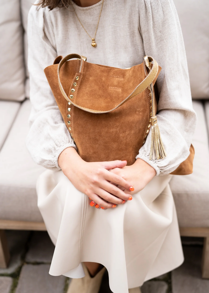 Suede tote bag with stud detail (tan) woman sitting 