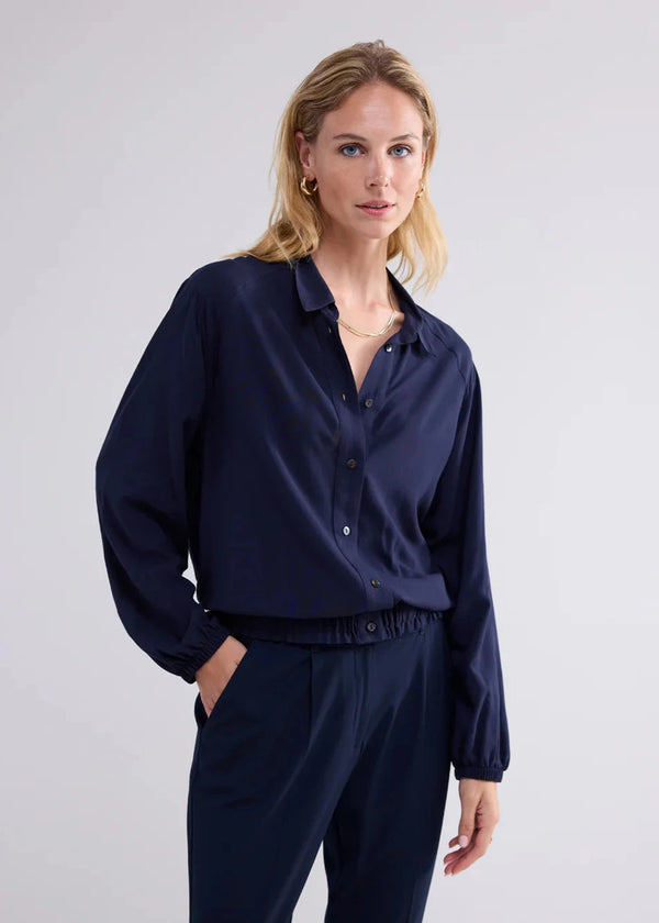 woman wearing Summum Woman Navy bomber blouse