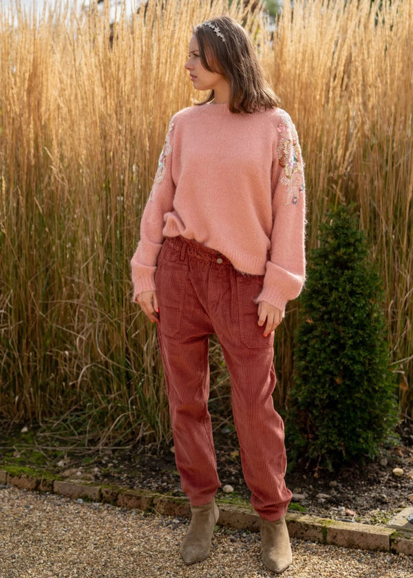 woman wearing  peggy jeans cordrouy in burgundy red 